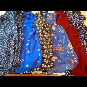 6 used women’s blouses.